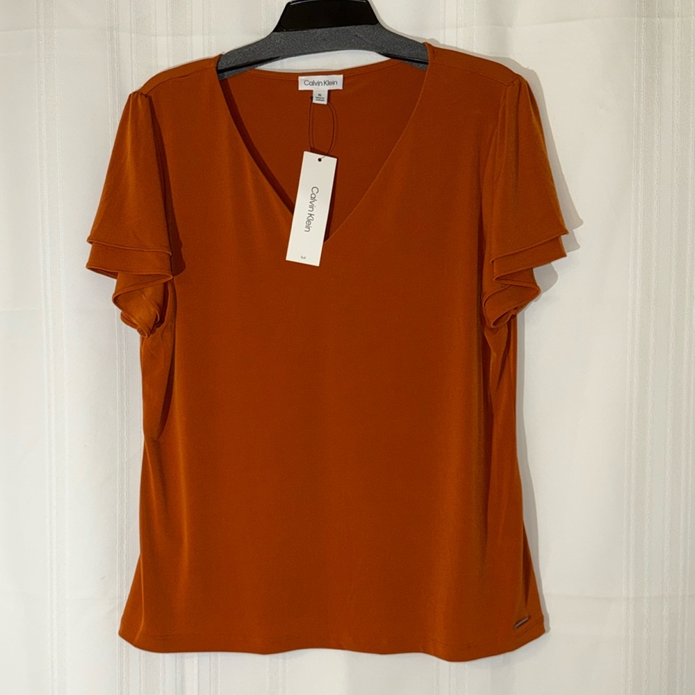Calvin Klein short butterfly sleeve suit blouse.